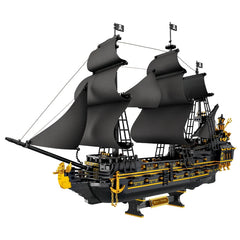 Model of a pirate ship with black sails and gold accents on a white background