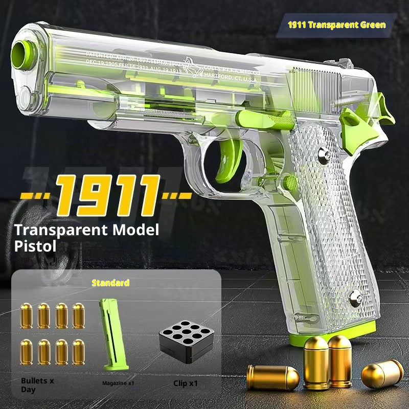 Transparent model pistol labeled '1911' with green accents on a dark background
