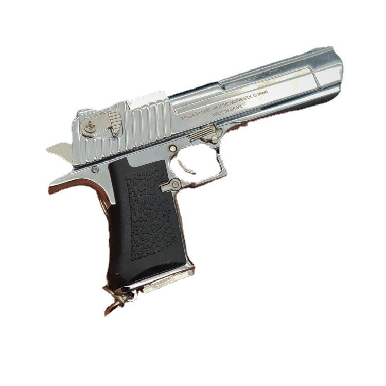 Silver and black handgun on a white background