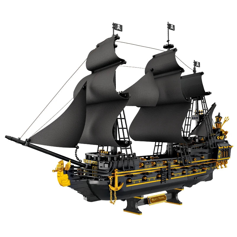 Model of a pirate ship with black sails and gold accents on a white background