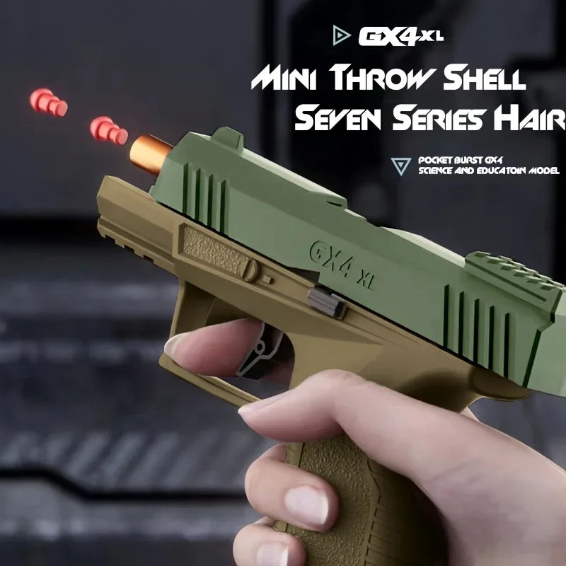 Green and brown toy gun held by a hand with 'GX4XL' branding.