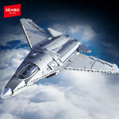 Toy model of a fighter jet flying above clouds with SEMBO BLOCK logo.