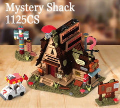 Toy set resembling the Mystery Shack from 'Gravity Falls' on a wooden surface.