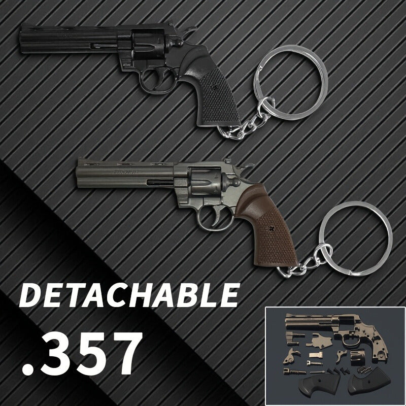 Two gun-shaped keychains on a textured black background with 'Detachable .357' text.