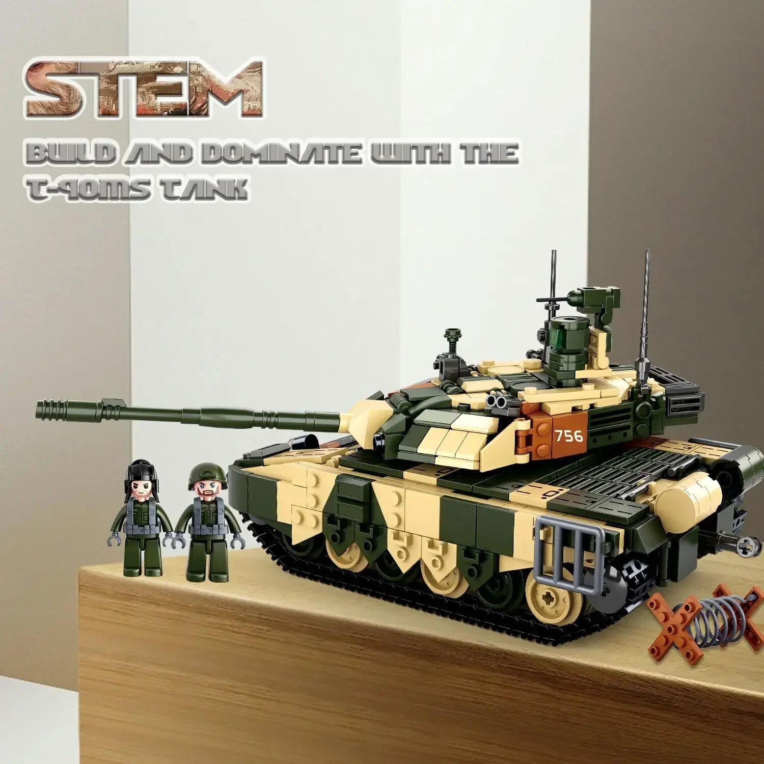Toy tank model with two figures on a wooden surface, featuring the 'STEM' branding.