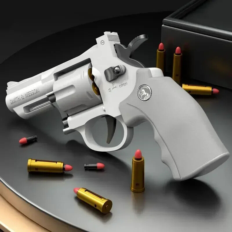 White revolver with bullets on a dark surface