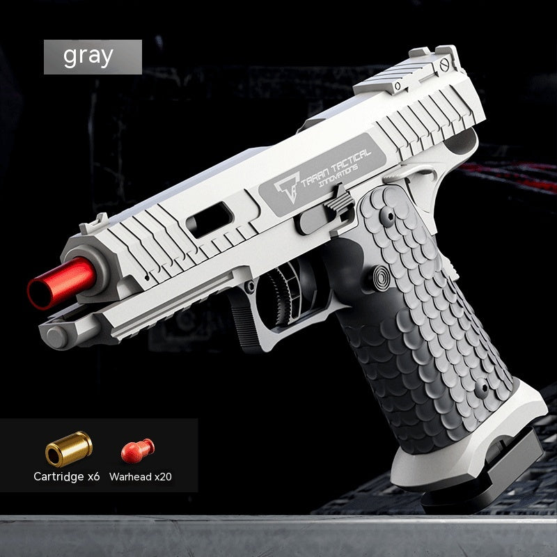 Gray toy gun with red tip on a black background