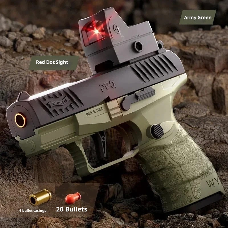 Toy gun with red dot sight on a rocky background